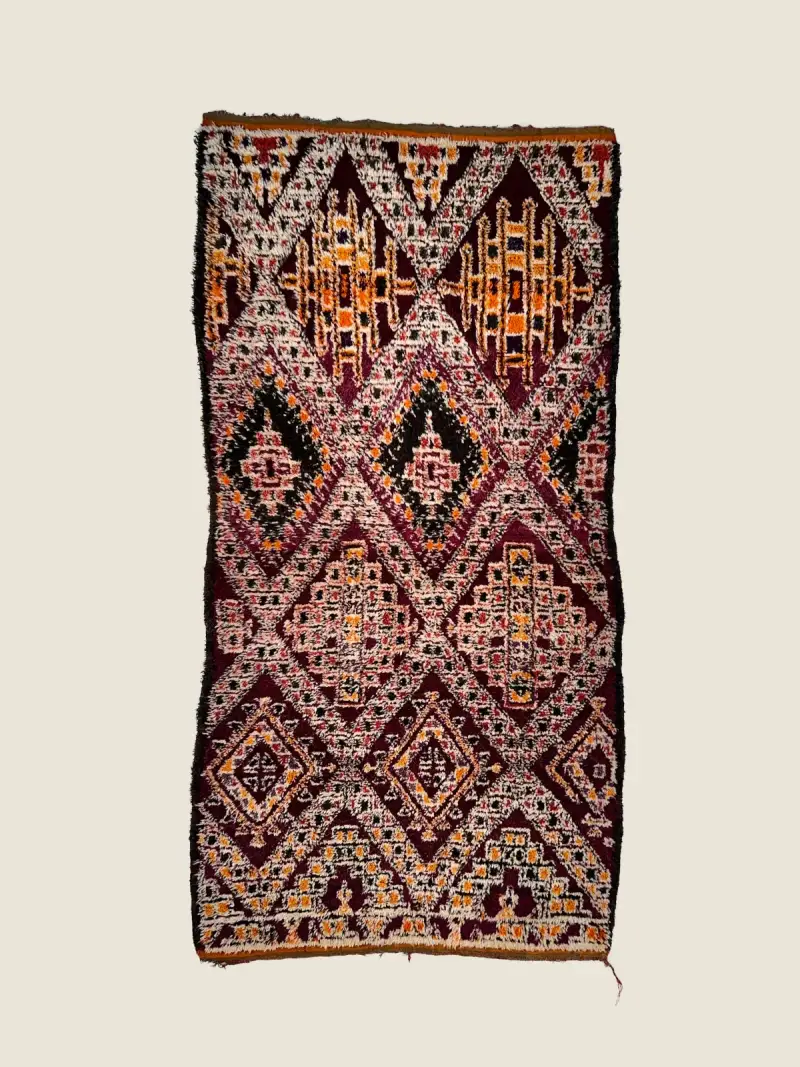 Vintage Beni M'guild rug 144×280cm, handwoven wool with vibrant orange and plum diamond motifs.