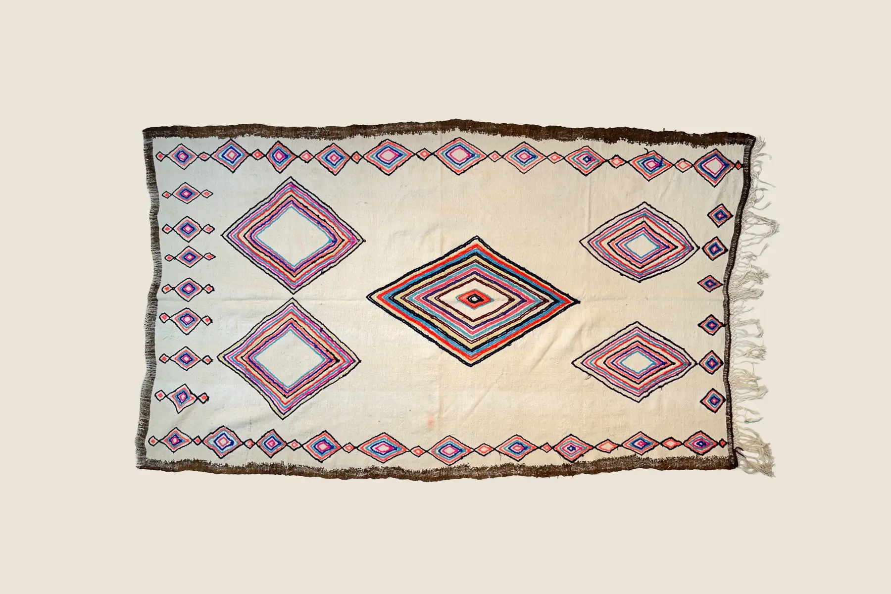 Azilal rug's light teal and brown wool texture showing hand-spun yarn and traditional weaving craftsmanship