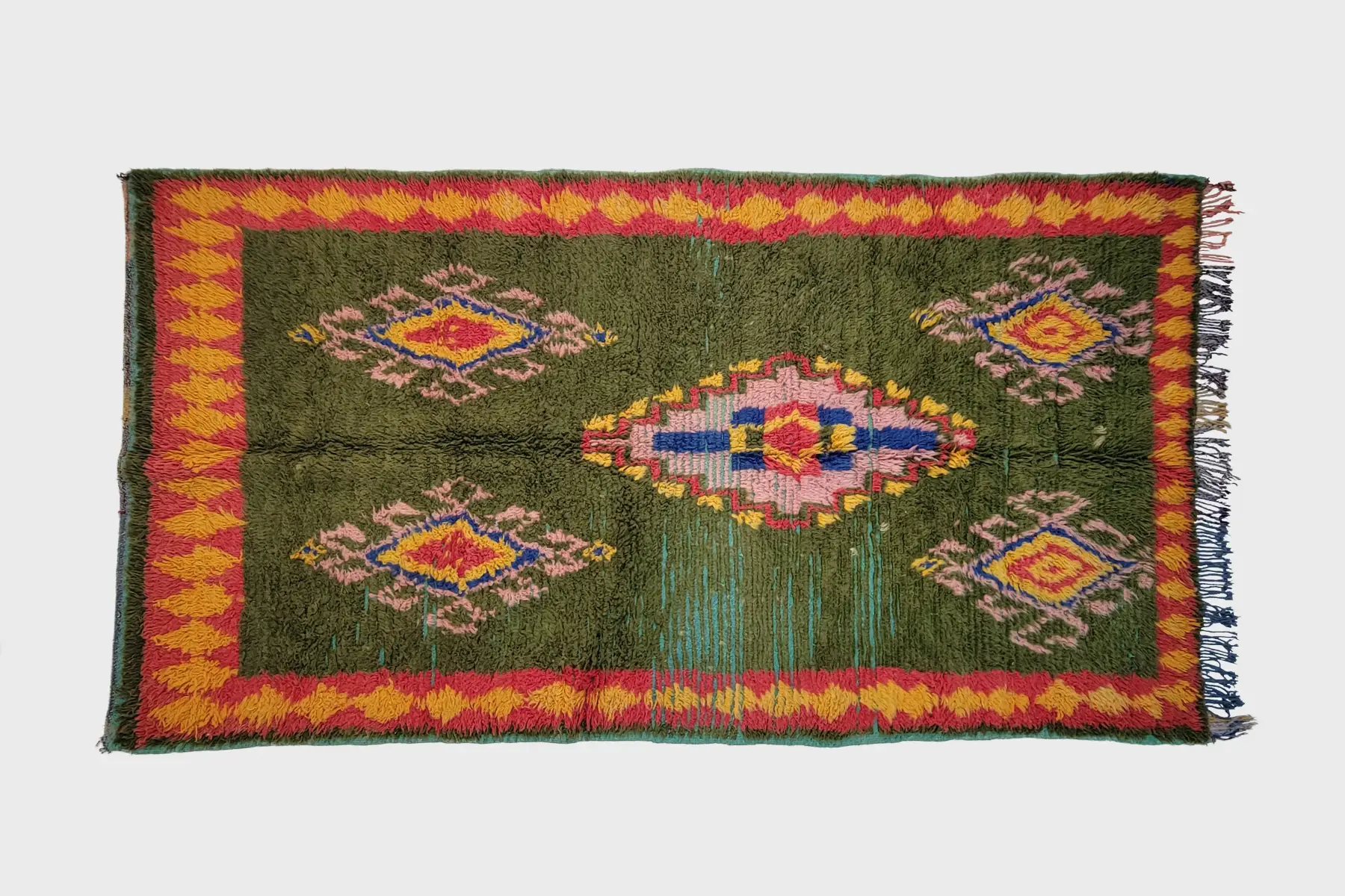 Beni M'Guild hand-knotted texture detail in muted olive gray and slate blue, showing traditional weaving craftsmanship