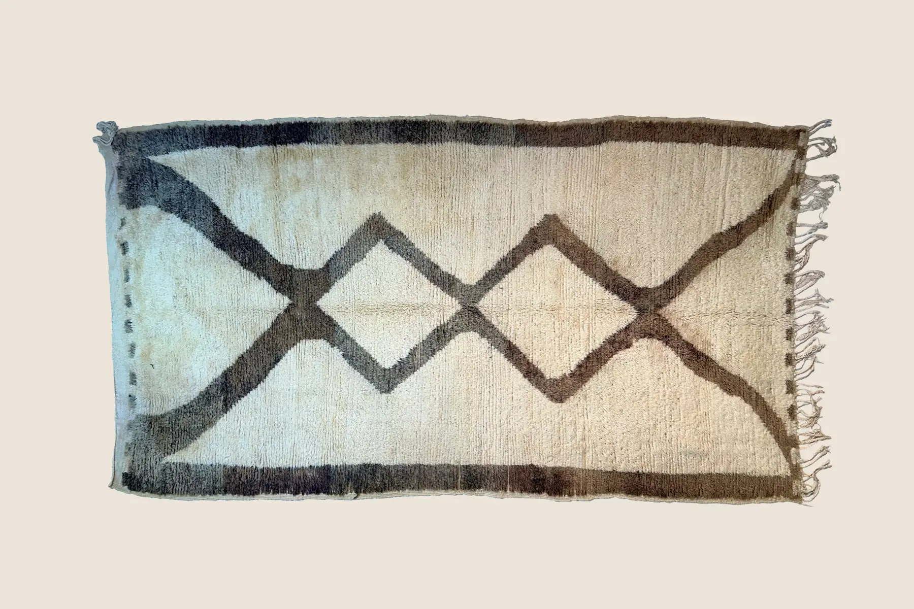 Beni Ourain high-pile texture detail showing hand-spun wool and diamond motifs