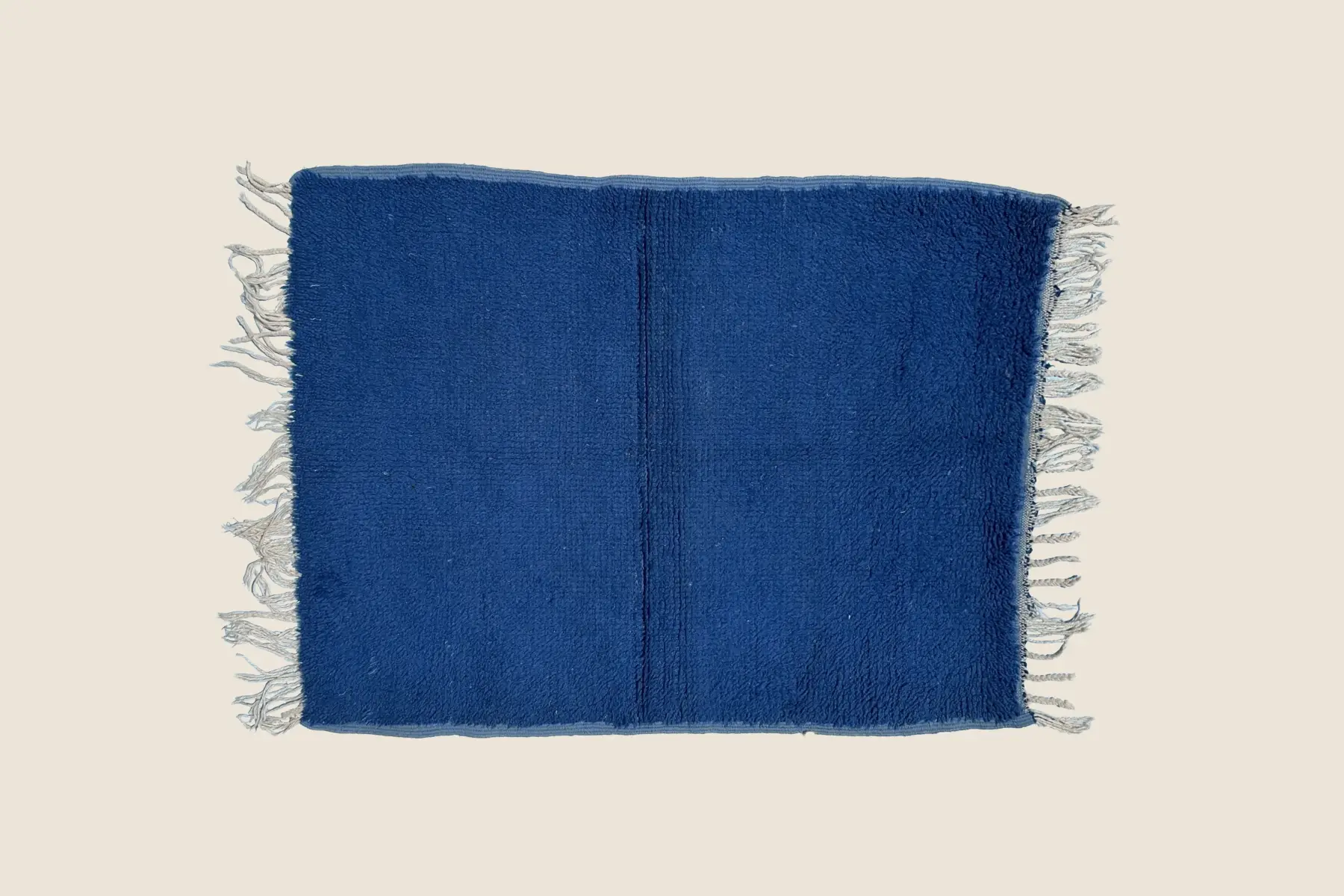 Beni M'Guild medium blue wool texture showing hand-tied pile and woven stripe detail – handcrafted in Morocco