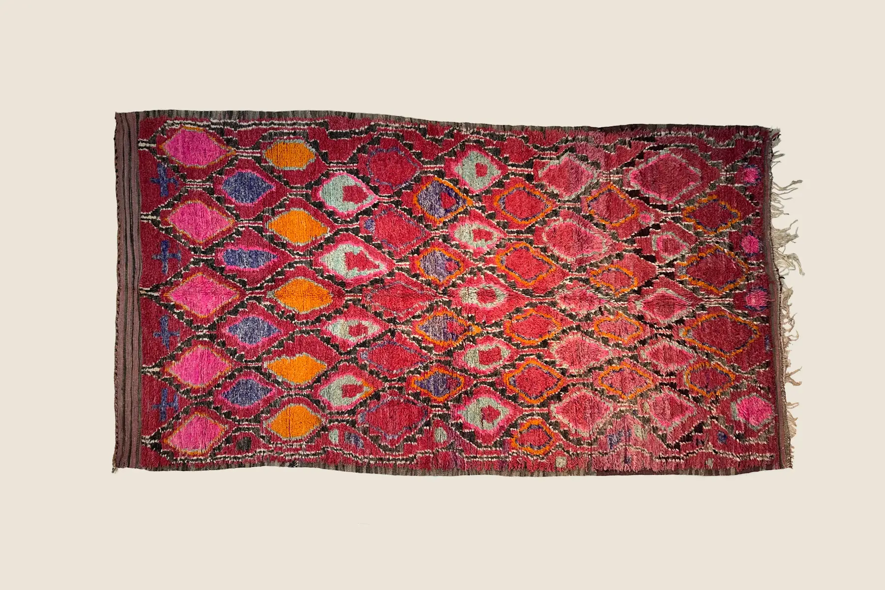 Talsint rug texture detail showing deep coral and teal gray hand-woven Moroccan weave craftsmanship