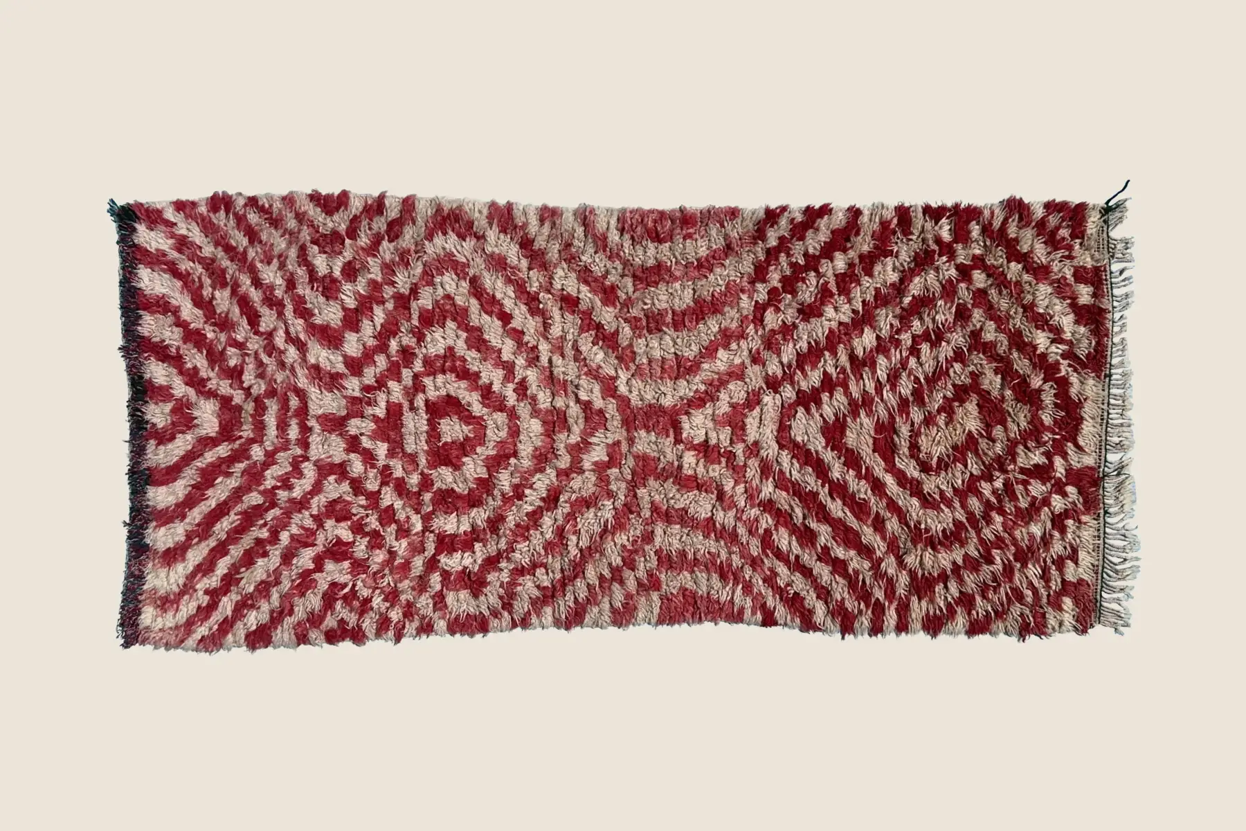 Talsint handwoven wool texture showing intricate Izrin motif detail and natural beige color variations
