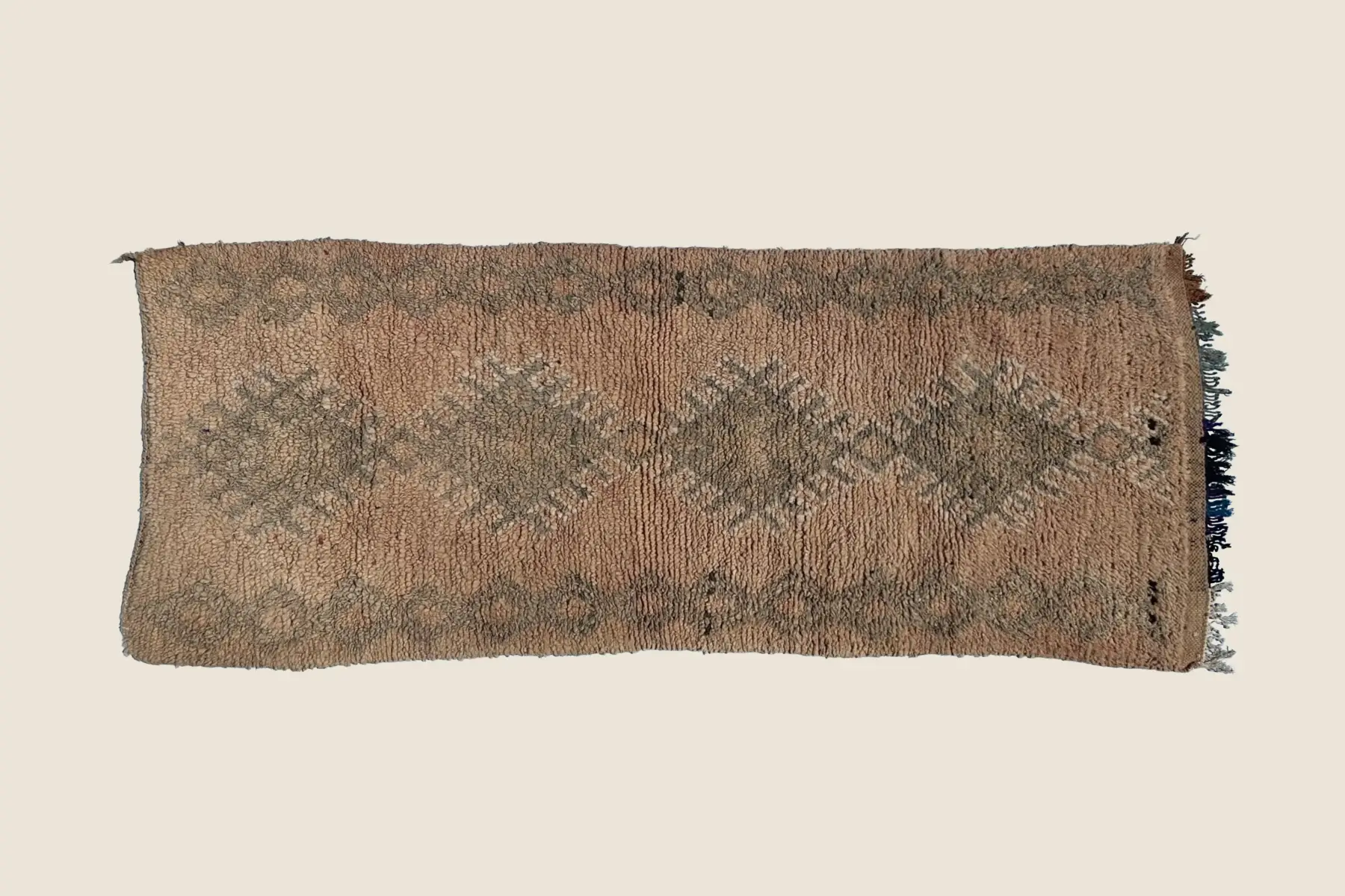 Beni M'Guild wool texture detail showing hand-knotted warm beige and brown stripe pattern with artisan weaving technique