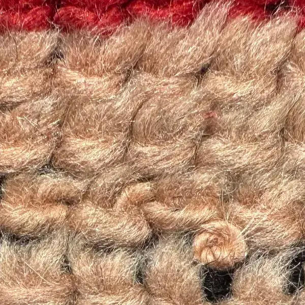 A color swatch labeled Warm Light Beige from the Atlas product line, showing a soft, warm beige tone in the
