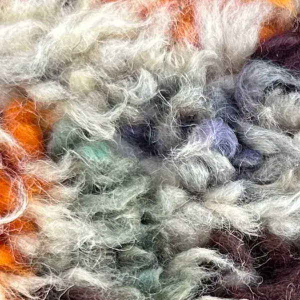 A color swatch labeled Warm Gray from the Atlas collection, showing a neutral gray tone.