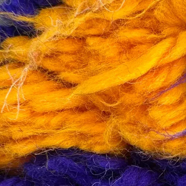 A color swatch labeled Warm Gold from the Atlas product line, showing a rich yellow hue.