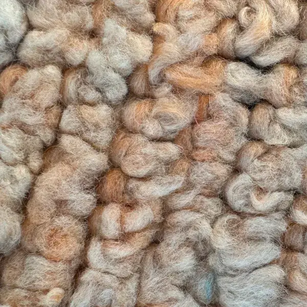 A color swatch labeled Warm Taupe, a muted orange-brown shade from the Handwoven Atlas Rug collection in Warm Earth T