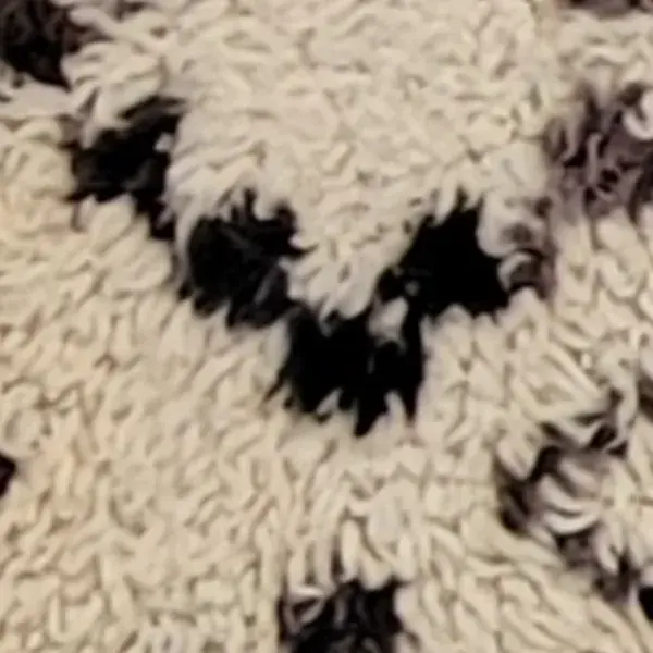 Charcoal black swatch on a Beni Ourain rug.