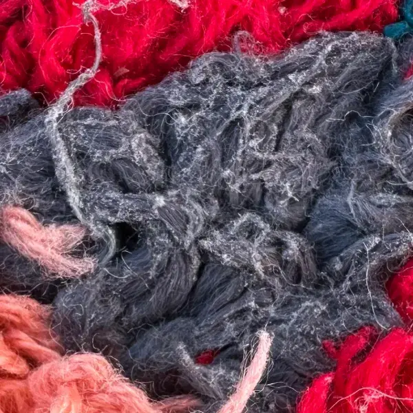 A color swatch labeled Medium Gray-Blue, hex code #56576a, from the Atlas product line in the gray