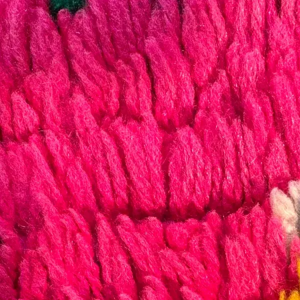 A deep pink circle symbol