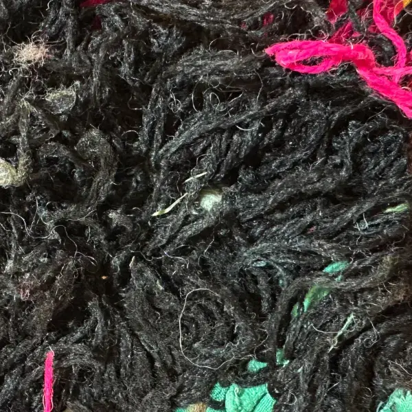 Dark charcoal gray diamond symbol on a color swatch.