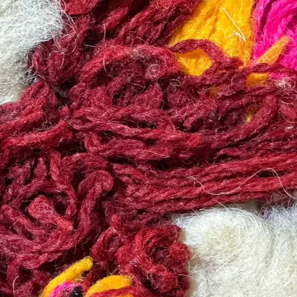 Deep burgundy red diamond symbol