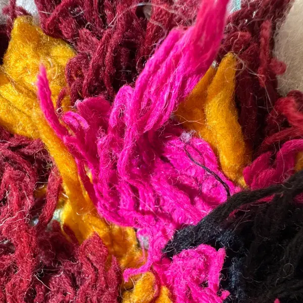 Vivid magenta diamond symbol on a pink background.