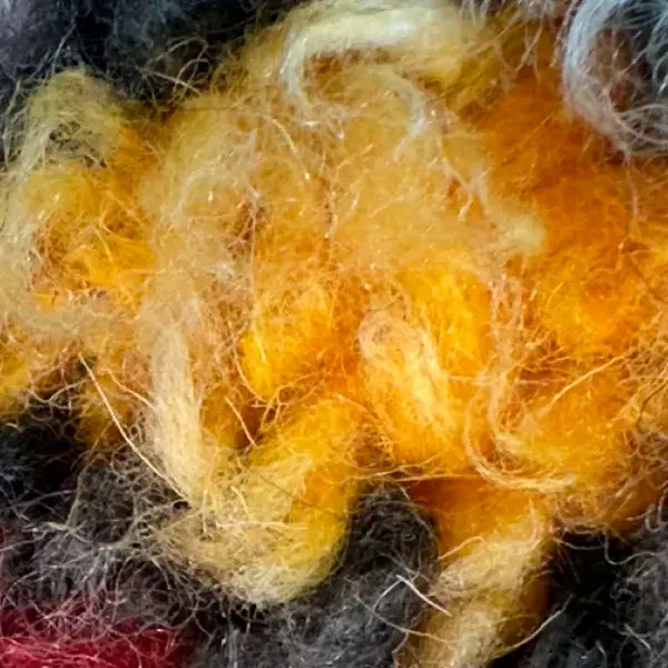 A warm mustard yellow color swatch with hex code #FFDB58.