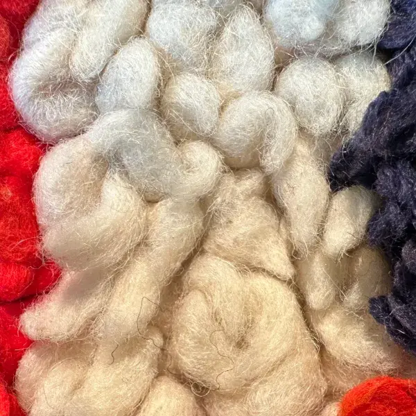 Light warm gray symbol with a subtle orange undertone