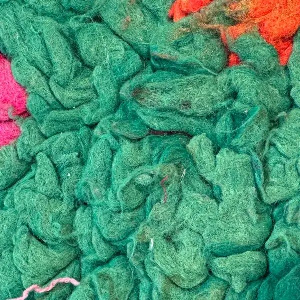 A medium teal green symbol