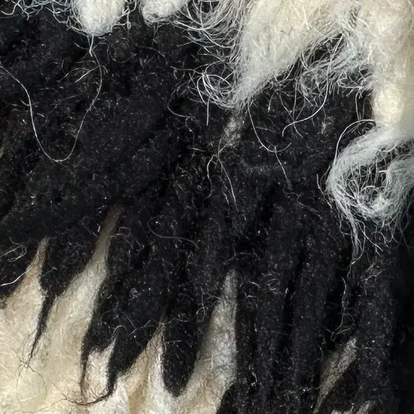 A color swatch labeled Dark Charcoal from the Atlas product line, showing a deep black-gray shade.