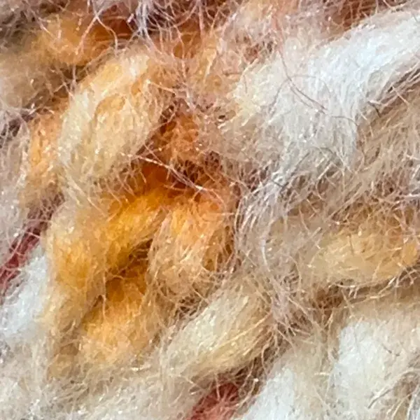 Burnt orange swatch from an orange wool rug.