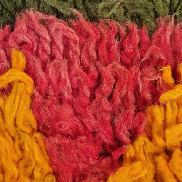 Dusty rose red color swatch from a Beni M'guild rug.