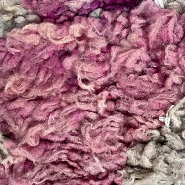 Geometric rug in a dusty rose pink.