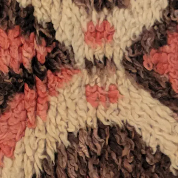 Light warm beige rug with diamond symbols