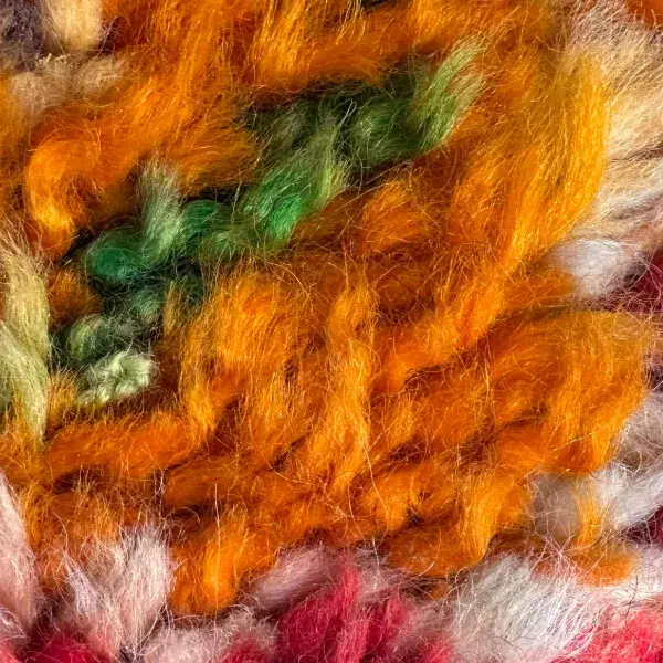 A warm amber orange diamond symbol.