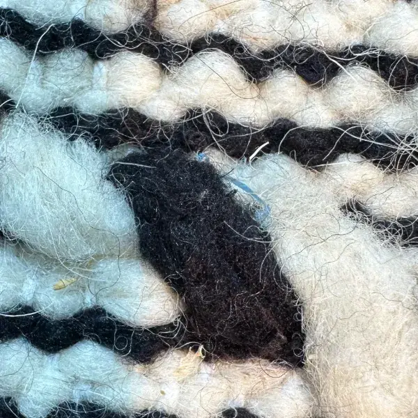 Dark charcoal gray zigzag pattern on a simple background.