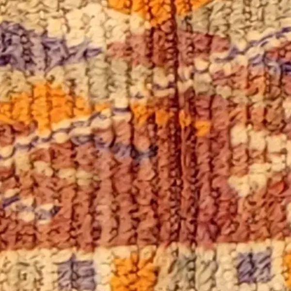 Warm orange color swatch for a Boujad rug in deep black.