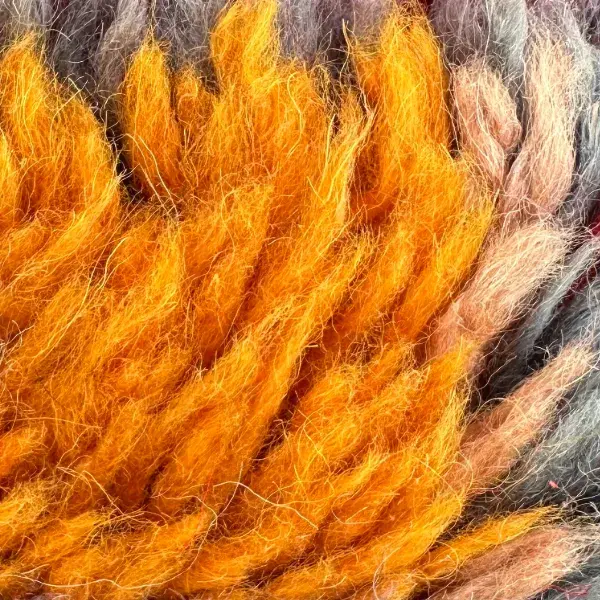 A warm orange-brown color swatch labeled Boujad from the orange color family.