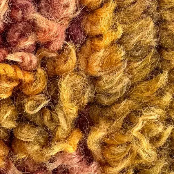 A color swatch labeled Warm Gold from the TALSINT product line, showing a rich orange-gold hue.