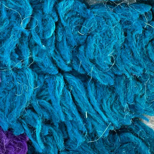 A color swatch labeled Deep Teal Blue from the Atlas product line, in the blue color family.