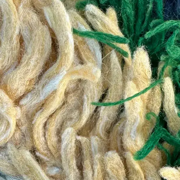 A color swatch labeled Warm Beige, a soft orange-toned neutral, from the Handwoven Atlas Rug in Slate