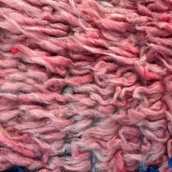 A color swatch labeled Warm Rose Beige from the Atlas product line, showing a soft, muted pinkish-beige tone