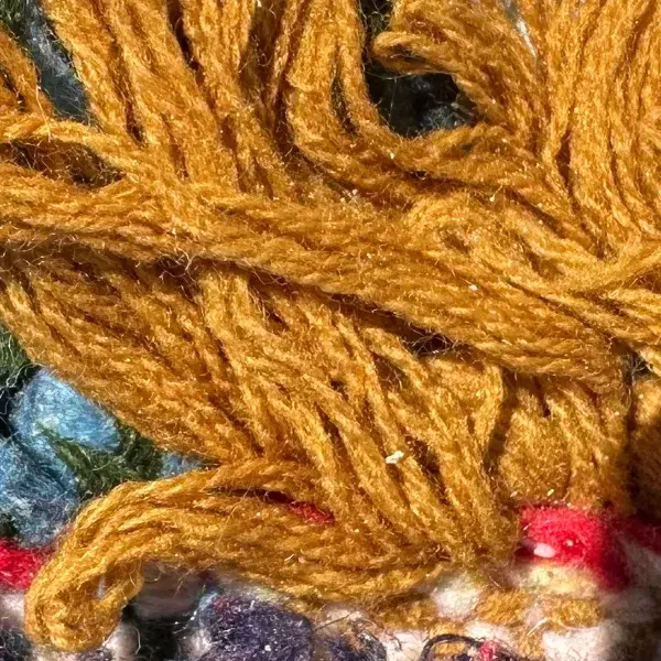 A color swatch labeled Warm Golden Brown from the Atlas product line, showing a rich orange-brown hue.