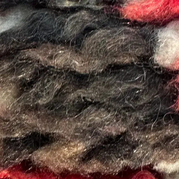 A simple diamond shape in a dark charcoal gray.