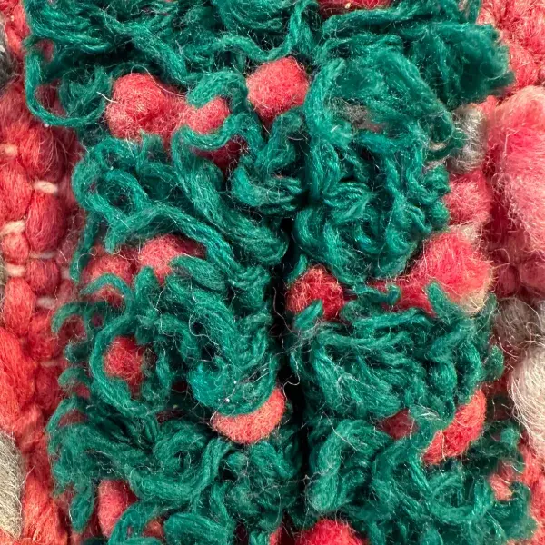 Muted sage green color swatch for a simple red wool rug.