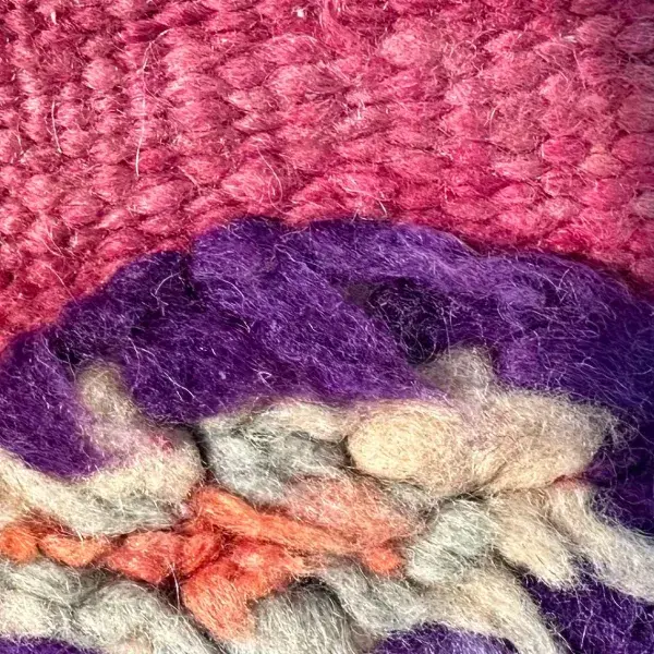 Deep purple zigzag and pointed symbols on a solid background.