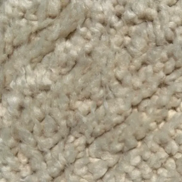 A warm light beige color swatch in soft neutral tones.