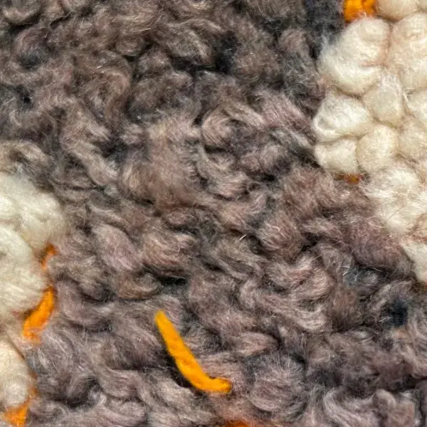 A warm medium brown color swatch from the orange family, with RGB values 167, 141, 127.