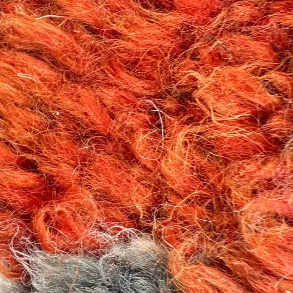 A warm orange color swatch from the Talsint product line, labeled Warm Orange.