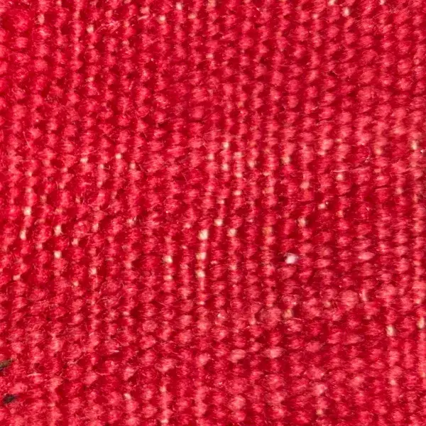A color swatch of Talsint Rug Warm Orange, a vivid red hue.