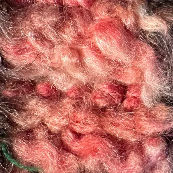 A light coral red diamond symbol.