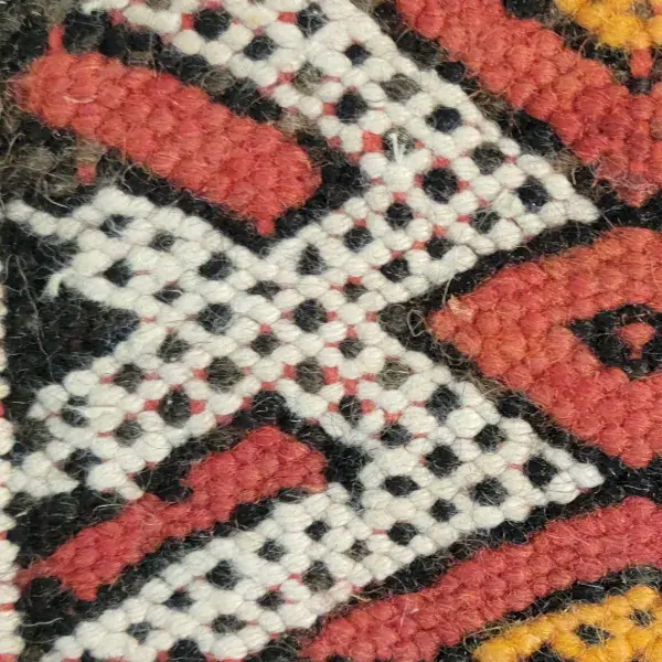 Light warm gray with a subtle yellow tone, reminiscent of kilim art textiles.